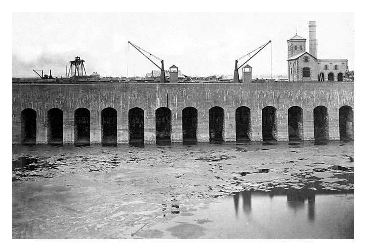 1865 – The beautiful symmetry and workmanship of the arched masonry quays