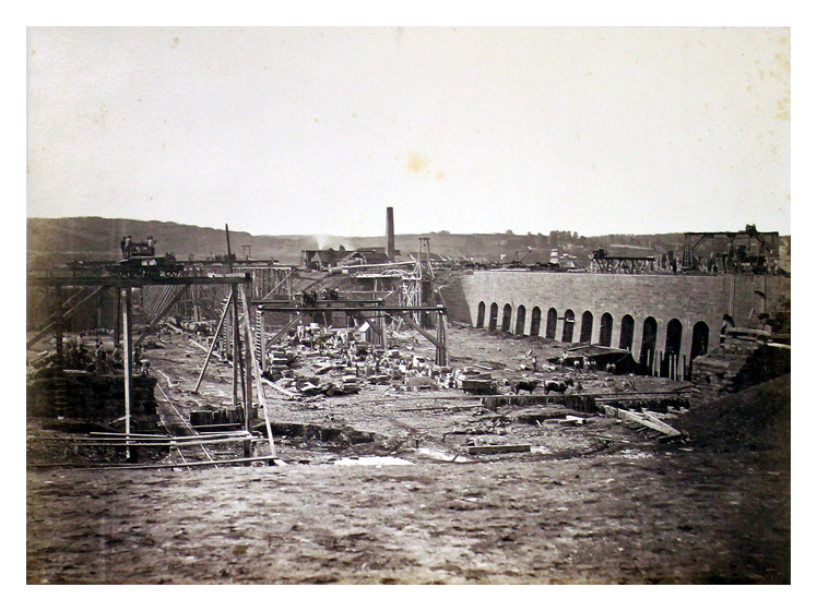Early construction work. Note horses and elaborate temporary staging. 82.36