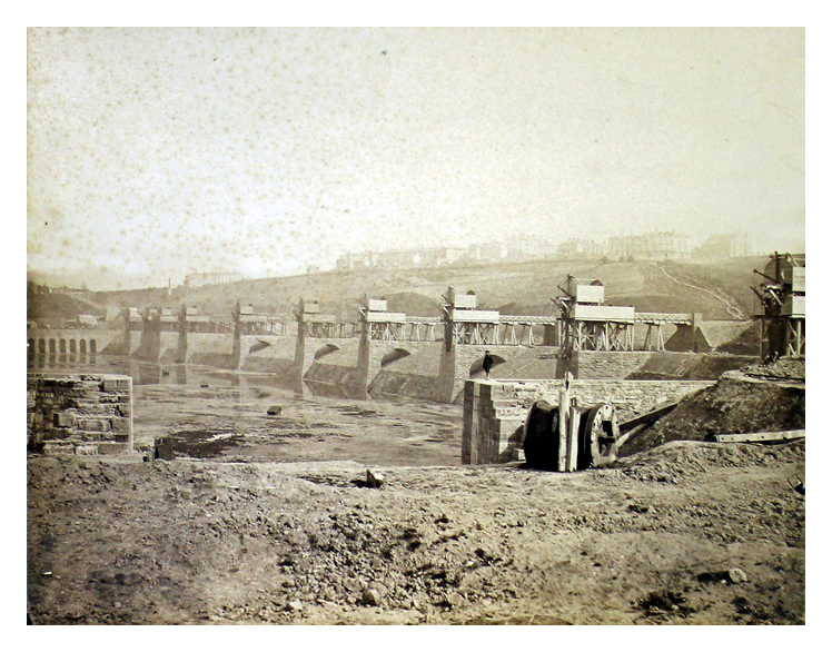 Prior to opening of the dock. Note gap in wall (foreground) at western end of dock. (Possibly it was intended at the time to construct a dry dock). 82.45