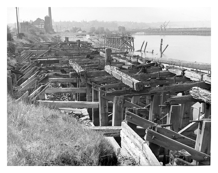 1950's - A photograph looking upstream of the River Ely towards the disused slipway and remains of the gridiron.