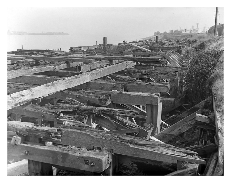 1950's - upper image - Another view downstream toward the Severn Sea of the derelict timber shoring on the Penarth bank of the Ely Estuary.