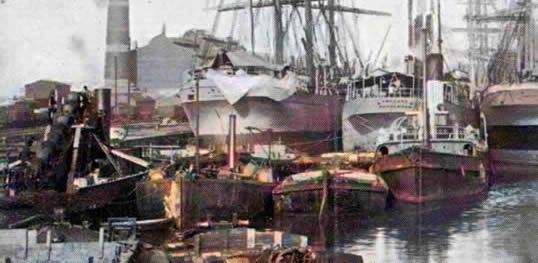 The dredger, some barges and the tug 'Primrose' in Penarth Dock.