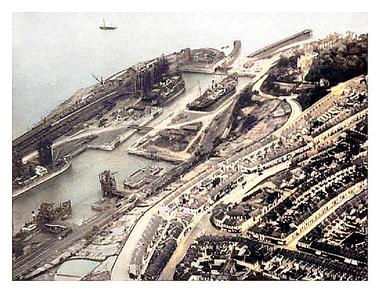 A photograph taken in the period 1927 to 1934 based upon the coal handling appliances etc. Note the trumpet bell shape of the entrance pier and jetty to the sea lock.