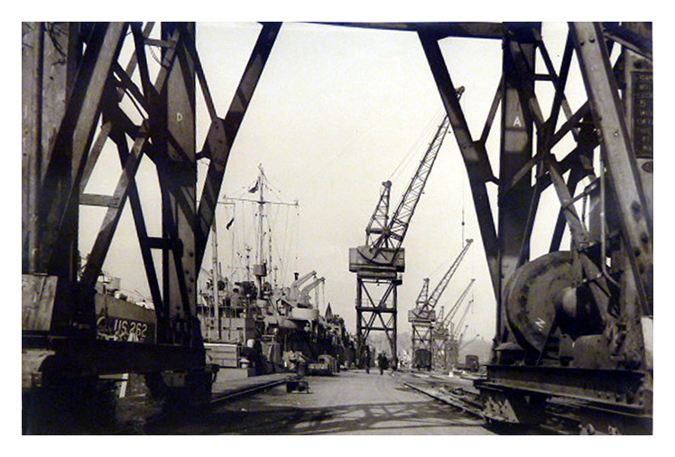 A plethora of cargo cranes were requisitioned by the War Department from the East Coast ports including Hull and Middlesbrough and installed along the northern quay at Penarth Dock in support of the war effort.