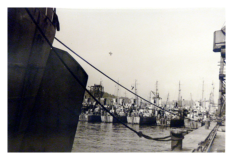 1943-4 - LST's lined up across Penarth Dock with a barrage balloon above to provide protection.