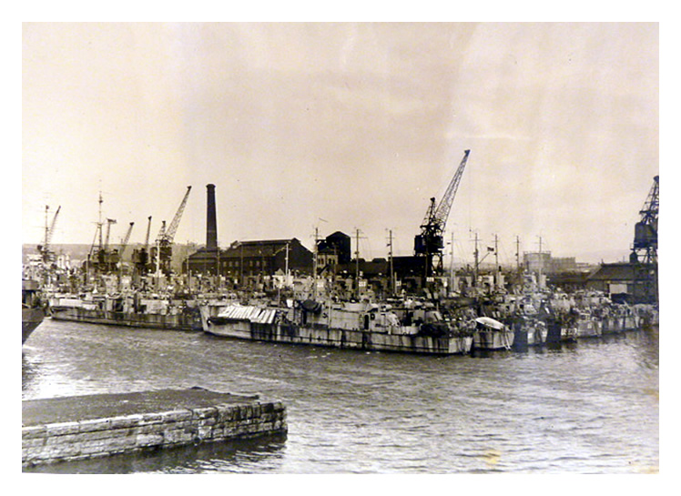 1943-4 - A view from the southern quay of the rows of LST's awaiting action. 