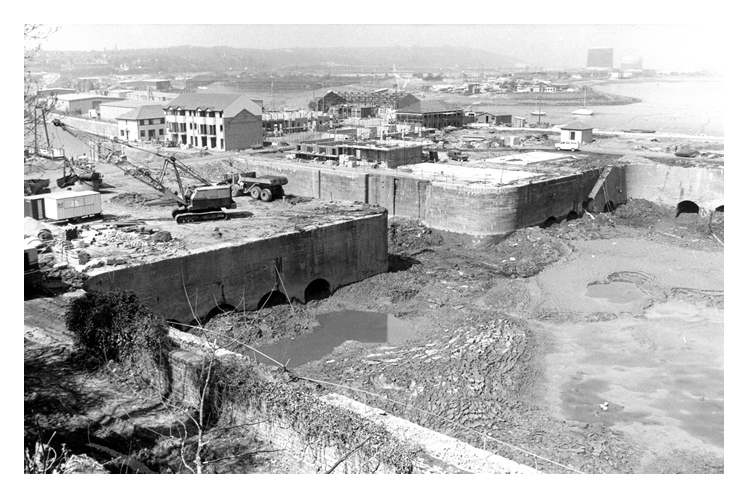 21st April 1987 - Construction of the Penarth Marina - A photograph taken from the former railway level serving the two coal tips on the southern side of the basin illustrating the extent of the debris and silt within the basin.