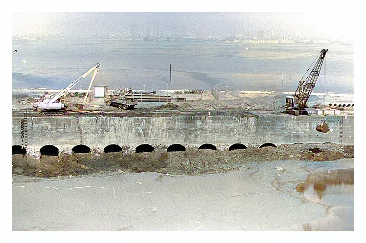 21st April 1987 - Construction of the Penarth Marina - Another photographic view taken from the high ground on the southern side of the basin illustrating the extent of the debris and silt within the basin.