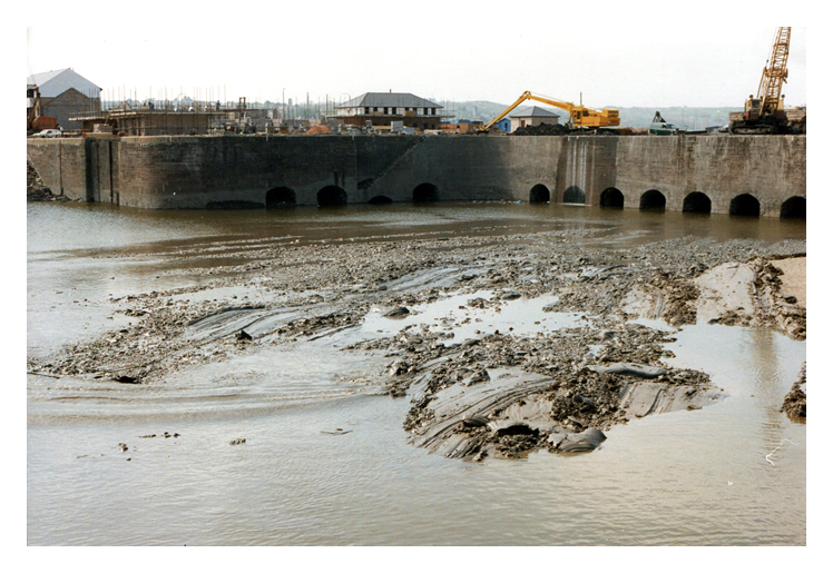 April 1987 - Construction of the Penarth Marina - A photograph of the Basin looking towards the north-east arched wall and the entrance to the lock between the basin and main dock.