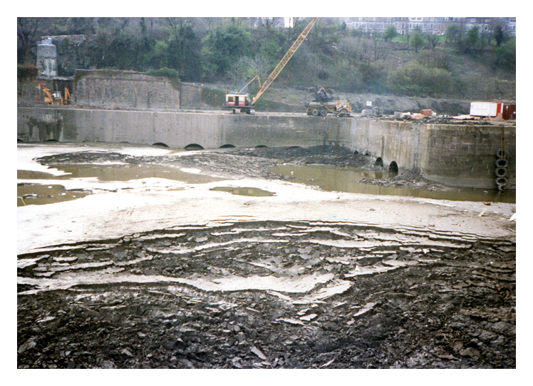 April 1987 - Construction of the Penarth Marina - A view across the Basin towards the south quay where the masonry works for the two coal tips of 1865 are situated. 
