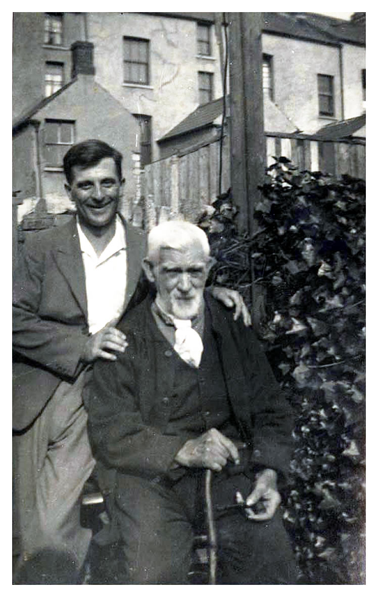 'A black and white picture postcard of Fred Balde and George Sims at Dock Street, Penarth. ' George was a toll keeper at the tunnel between Cardiff and Penarth.