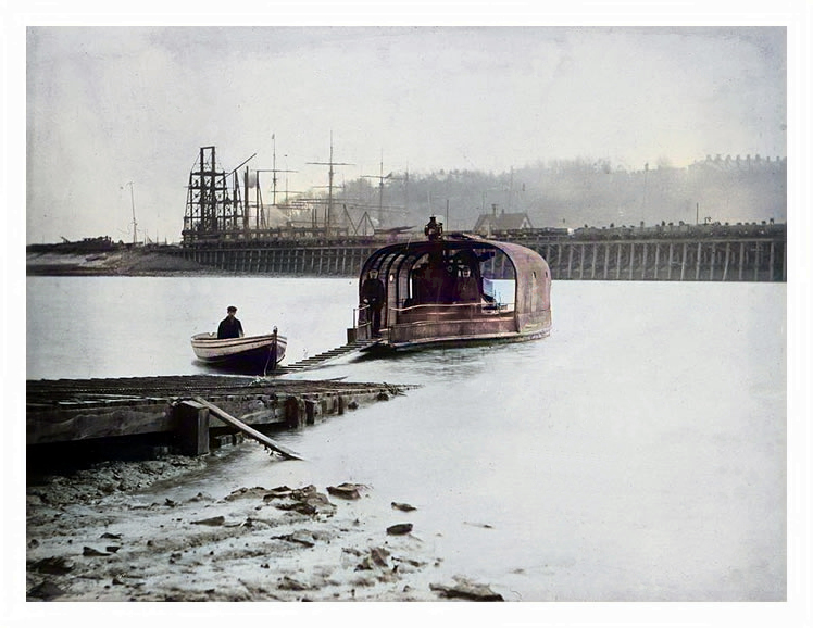 1899 - A photograph of the old chain ferry with the timber shorings supporting the river embankment.