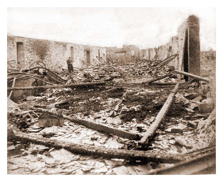1888 - After the fire - The exterior of 'T' Warehouse at Victoria Wharf, Ely Tidal Harbour, Penarth Dock. 