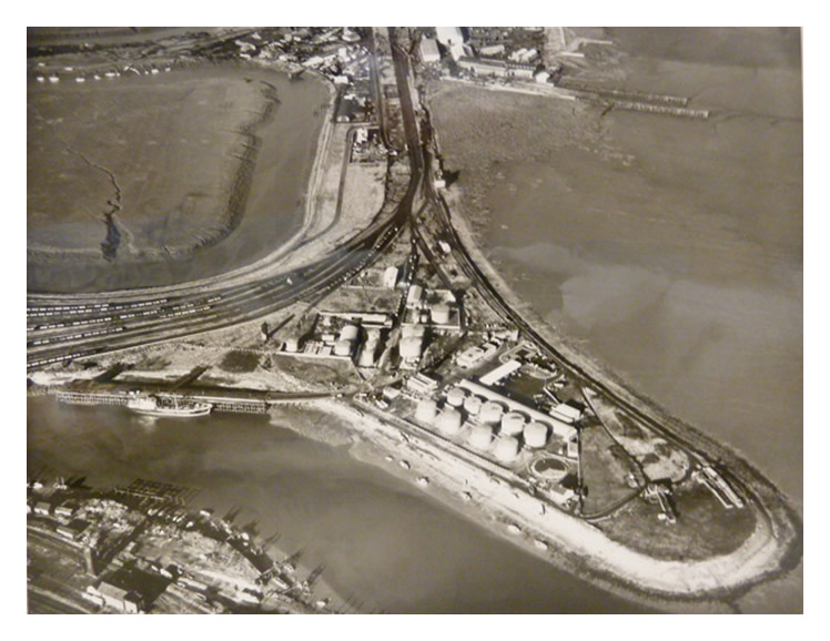 1962 - An aerial view of the mouth of the River Ely showing the extents of the oil storage facility on the Grange point.
