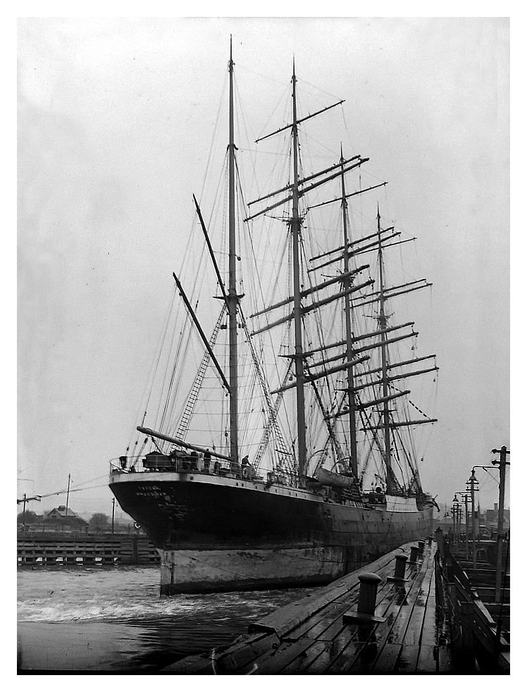 1950 - 'Passat' at Penarth Docks close to the northern entrance pier. The wash from the tug at her stern suggests she is being brought to a halt or is being manoeuvred to align with the entrance lock to the Basin. Gorgeous!