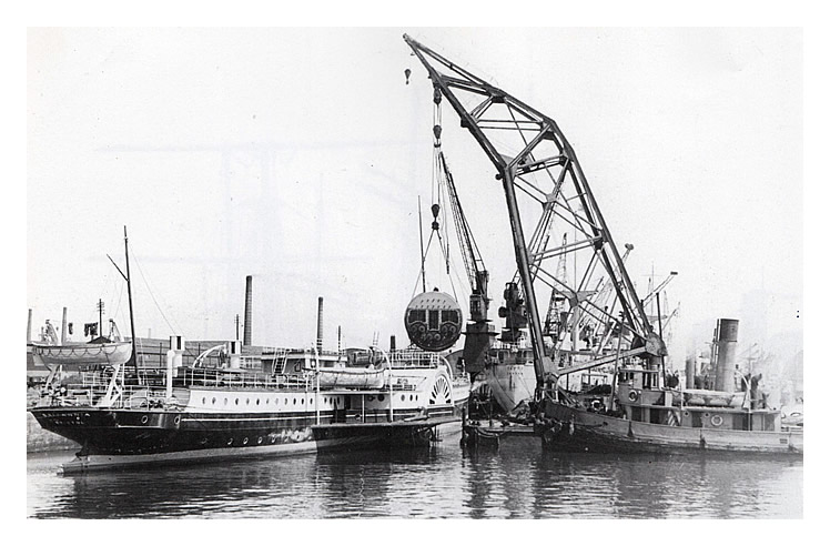 P.S. 'Britannia' undergoing a major refit with the removal of the old coal-fired boiler and its replacement with an oil-fired boiler at Cardiff Docks during 1947