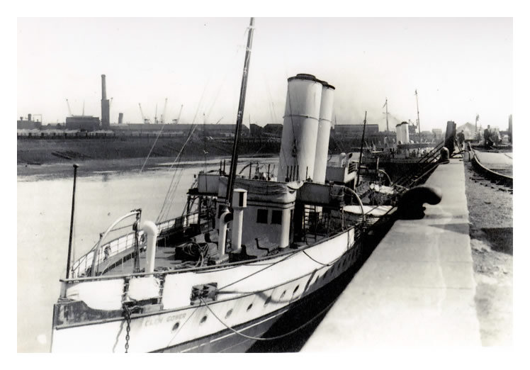 p.s. 'Glen Gower' with one of the 'Queens' landing passengers astern of her.