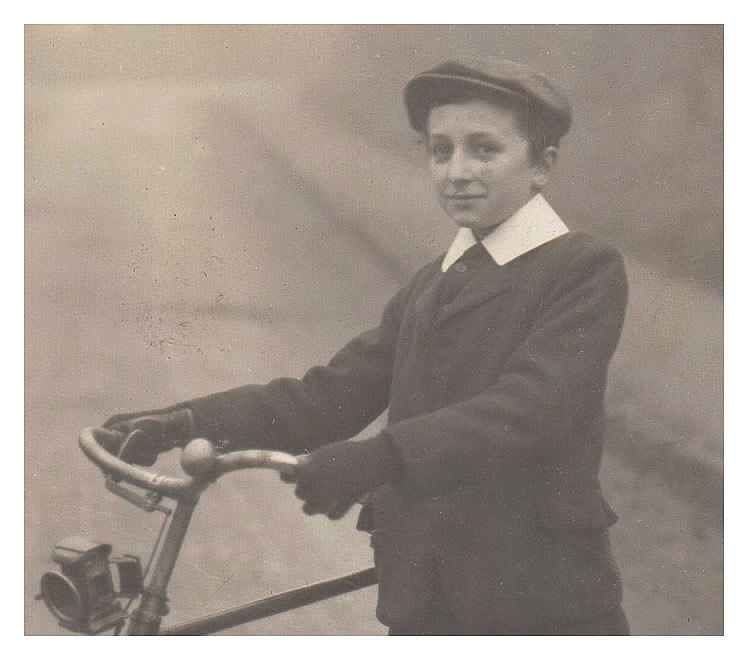 Photograph of a boy and a bicycle as published in postcard format by G. Wehrley & Co., 97, Glebe Street, Penarth, S. Wales. 