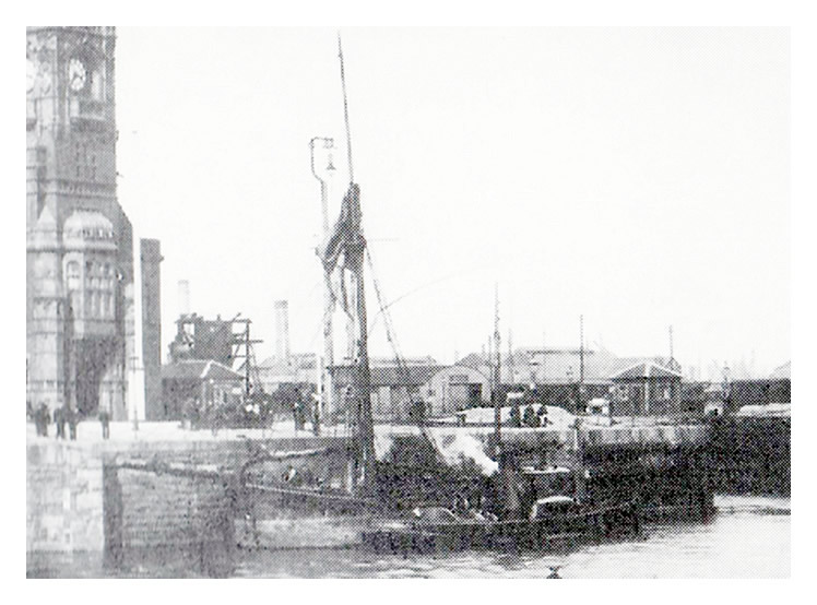 c.1910 - The trow 'Caroline' - awaiting near the entrance to the Bute West Dock at Cardiff together with a steam tug, probably the Falmouth tug 'Sylph.'