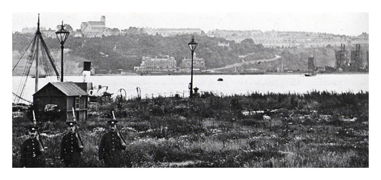 1914-18 - A view across the mud toward Penarth Head and the Mercantile Marine Office Building and Customs House at Penarth Dock.