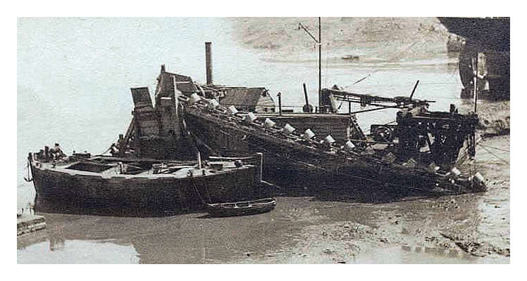 1890 - A dredger and lighter barge at low water close by Pierhead, Bute Docks, Cardiff.