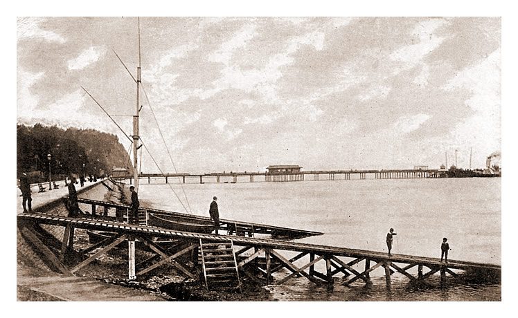 A postcard view c.1903 of the Penarth beach, yacht club slips with the pier and Penarth Head.