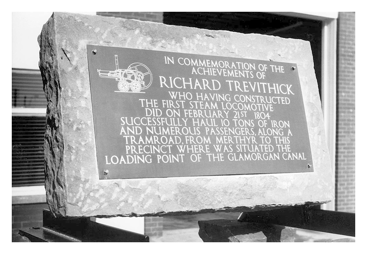 In commemoration of the achievements of Richard Trevithick who having constructed the first steam locomotive did on February 21st 1804 successfully haul 10 tons of iron and numerous passengers along the tramroad from Merthyr to this precinct where was situated the loading point of the Glamorgan Canal. 